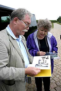 Joy Erickson reviews family history with a resident of her ancestral town in Germany. 