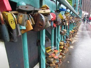 Padlocks, thousands of them, on a bridge in Wroclaw, Poland in the spring of 2013. Spreading pollution or cute devotion?