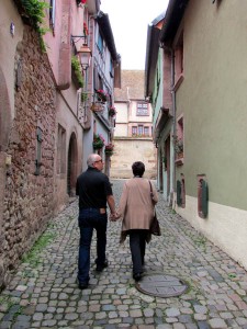 Jim and Denise walk down a quiet lane in Riquewihr