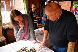 Marv Rosen looks at family photos and goes over genealogy with a relative at the Rosenwinkel home in Marklohe, Niedersachsen on September 28, 2014