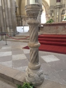 The cloister and a candlestick from the previous church, dated around 1125.